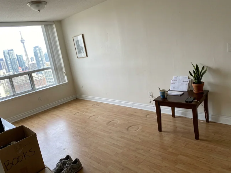 Condo living room after couch removal